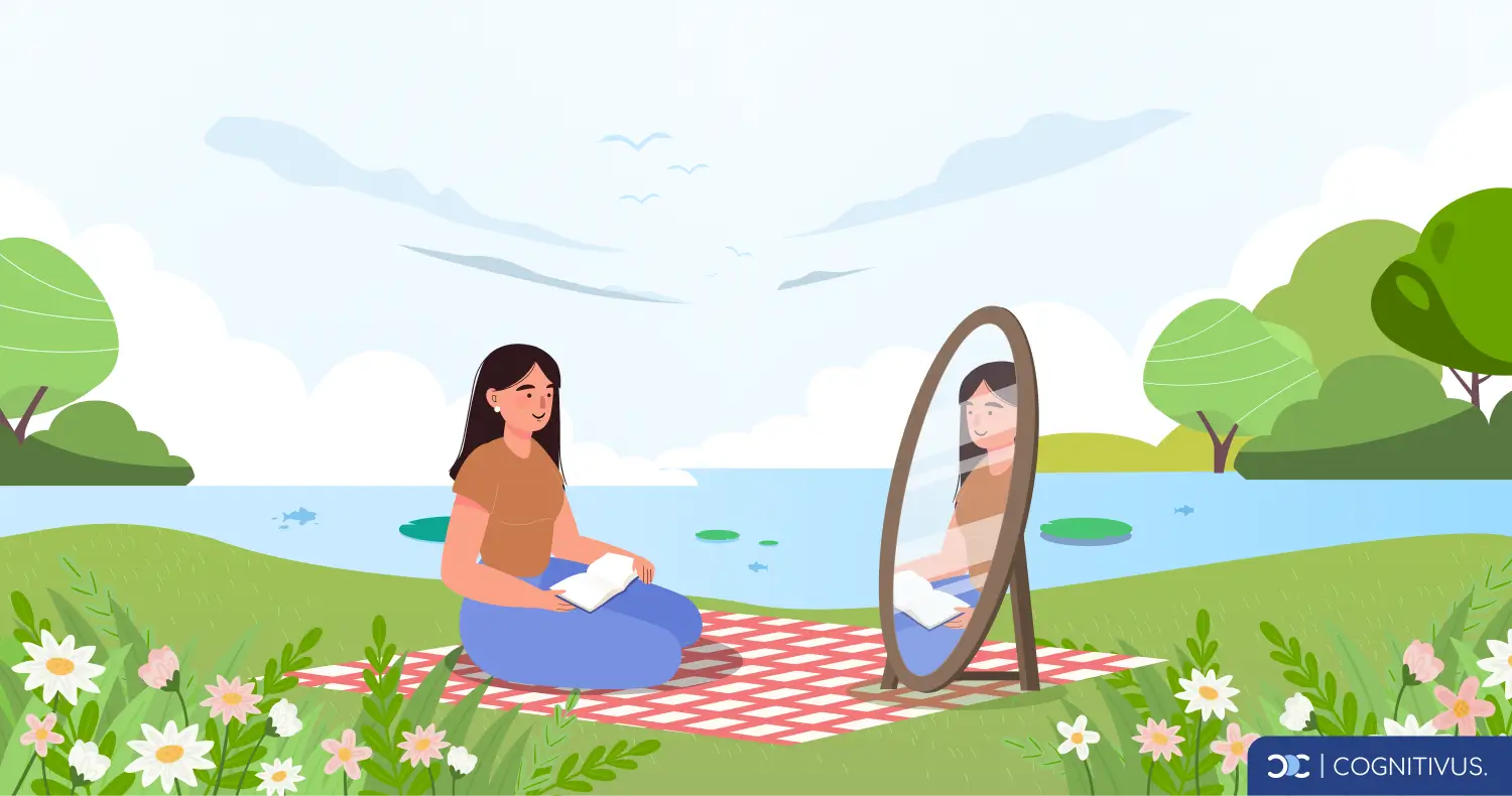 A woman sitting by a lake reflecting in a mirror, symbolizing self-reflection for emotional growth