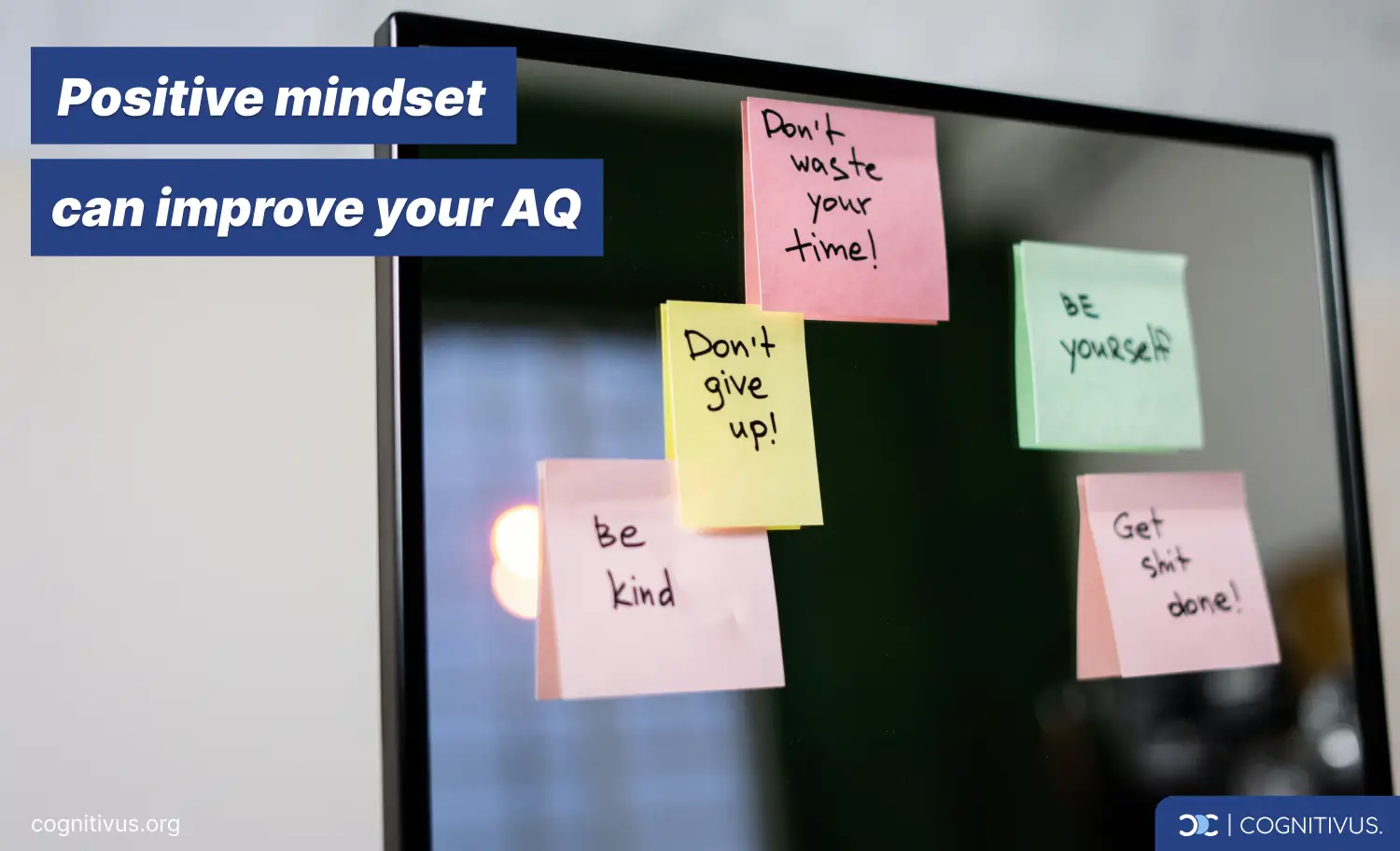 Sticky notes on monitor with motivational messages to improve Adversity Quotient: don't waste your time, don't give up, be kind, be yourself, get things done.