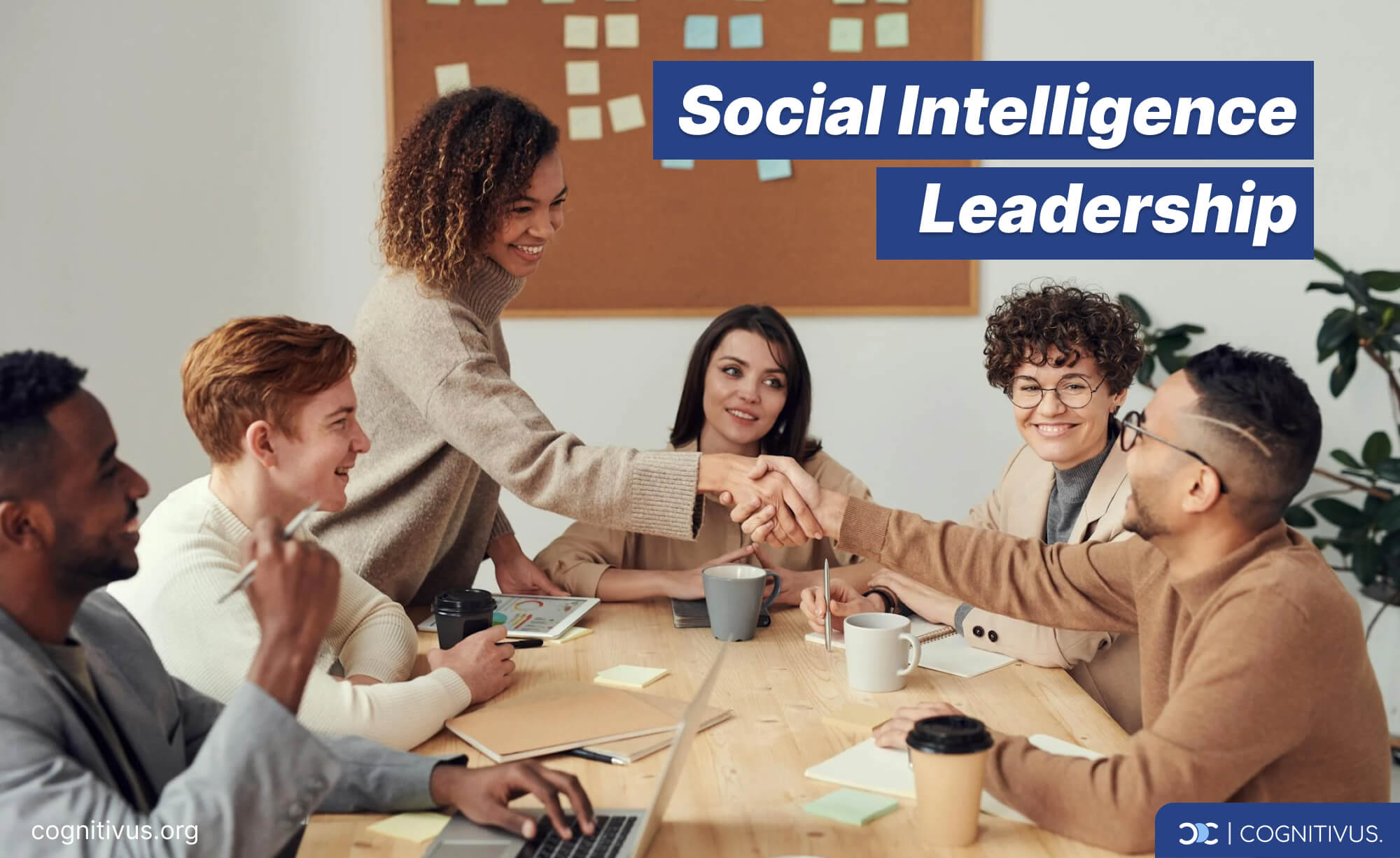 A diverse team of smiling professionals in a meeting around a table, showcasing social intelligence 