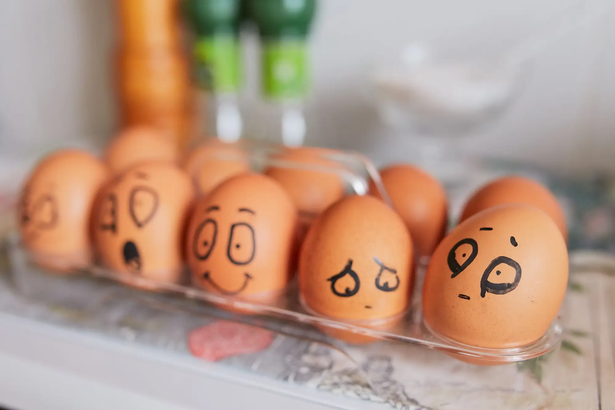 Eggs with drawn faces showing different facial expressions, a playful take on emotional intelligence